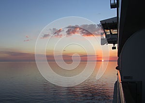 This is a beautiful sunset over the Gulf of Mexico as seen from the balcony of a cruise ship. photo